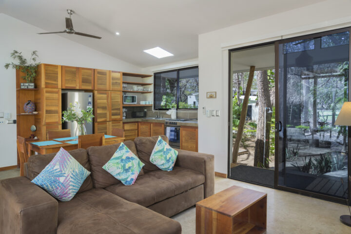 Invest_Nicaragua_Real_Estate_Tola_Eco_Casita_6_Living_Area_Kitchen_CC_HIGH_RES-720×480-1